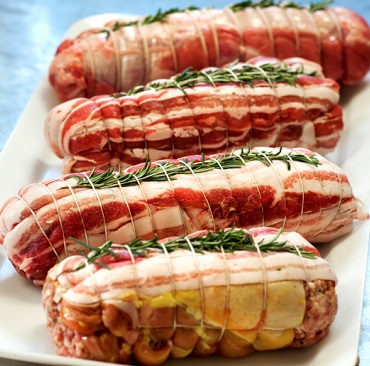 tied-up-raw-rolled-veal-bundles_126745-217